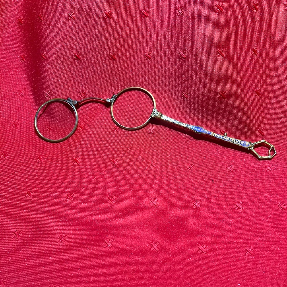 antique lorgnette, a type of spectacles with a handle.